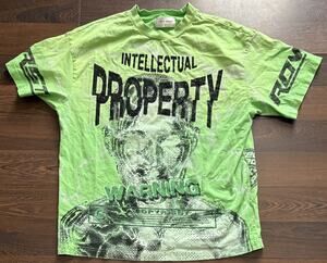 FIRST ROW INTELLECTUAL PROPERTY GRAPHIC TEE OVERSIZED GREEN WOMENS SZ MEDIUM